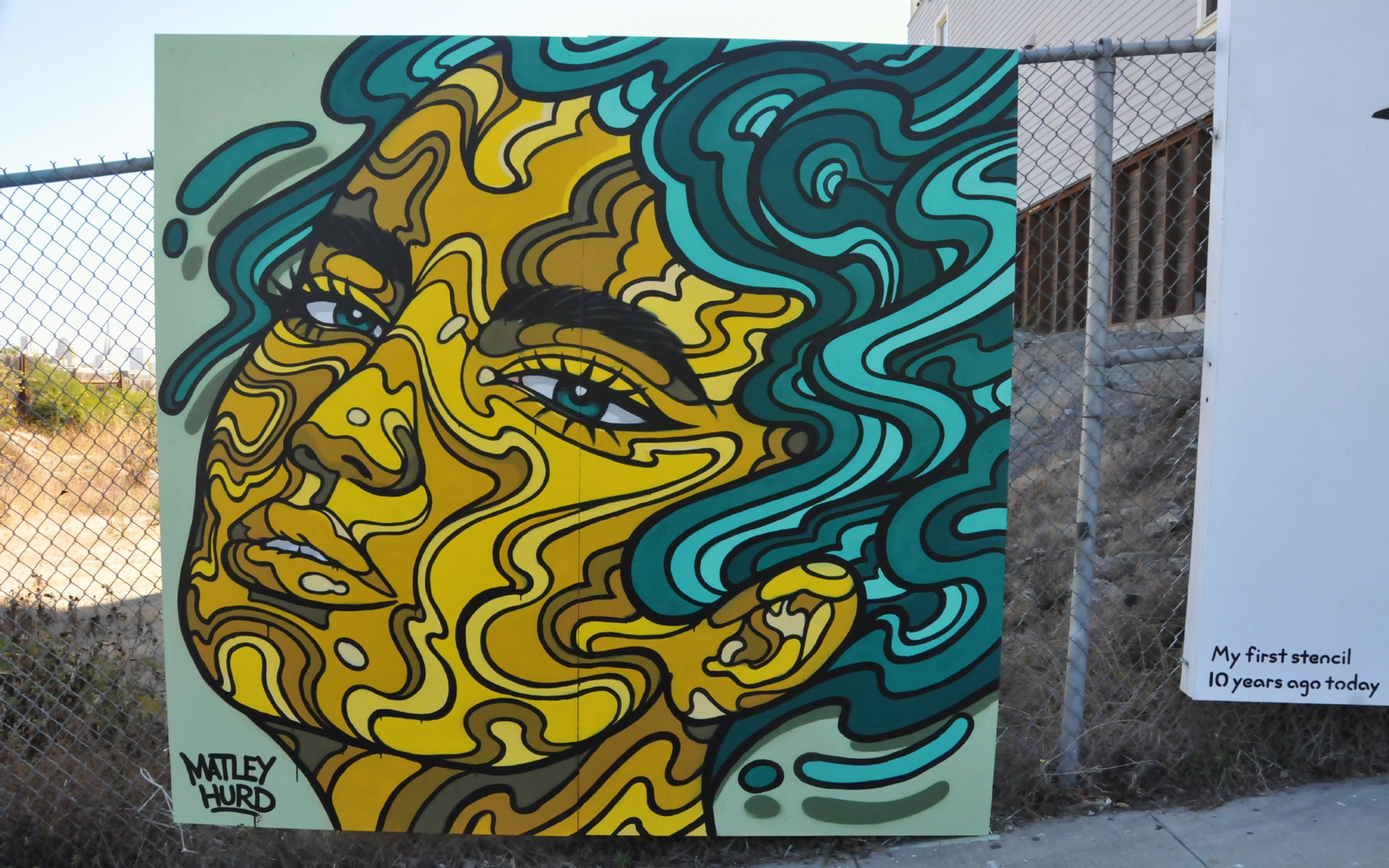 ./Woman_Face_Mural_On_Fence_by_Matley_Hurd_20230913_111942_C23_2782.jpg